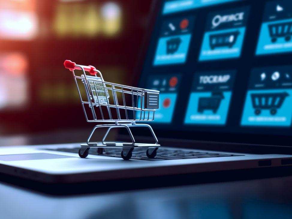 Mini cart on laptop with blurred e-commerce screen in the background