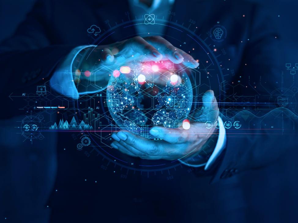 Businessperson holding a digital globe with tech icons